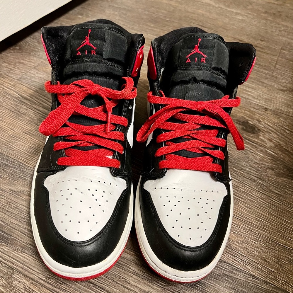 The famous Air Jordan 1’s in the red, white, and black color way.